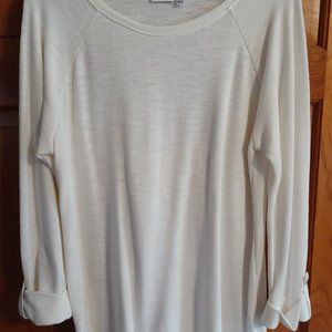 Long sleeved white sweater.